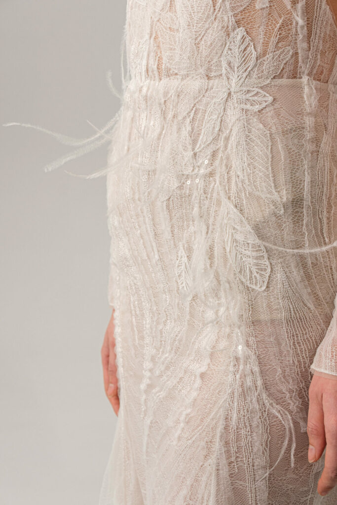 Bride in the sheer embroidered Anouka wedding dress by Mira Zwillinger