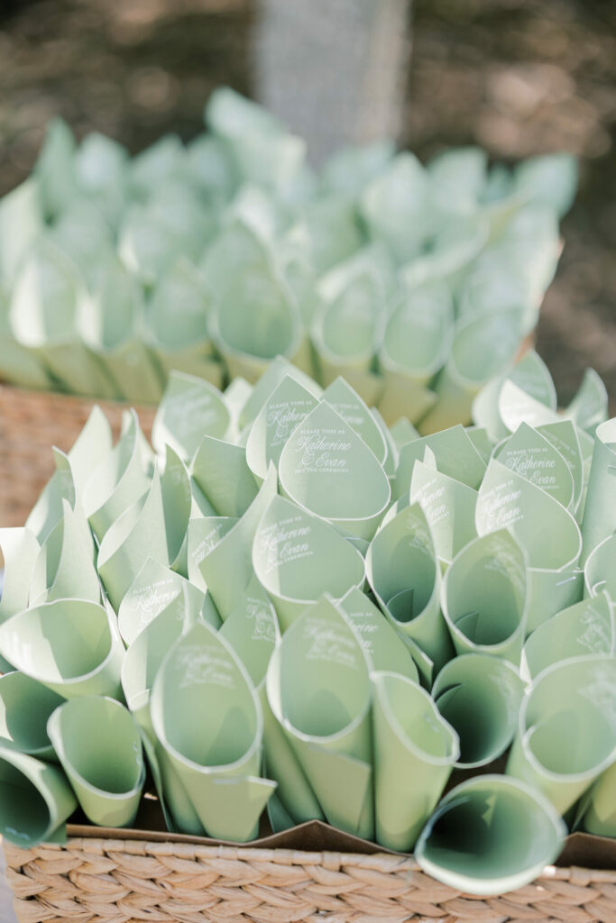 Mint green paper cones in a basket, elegant display.