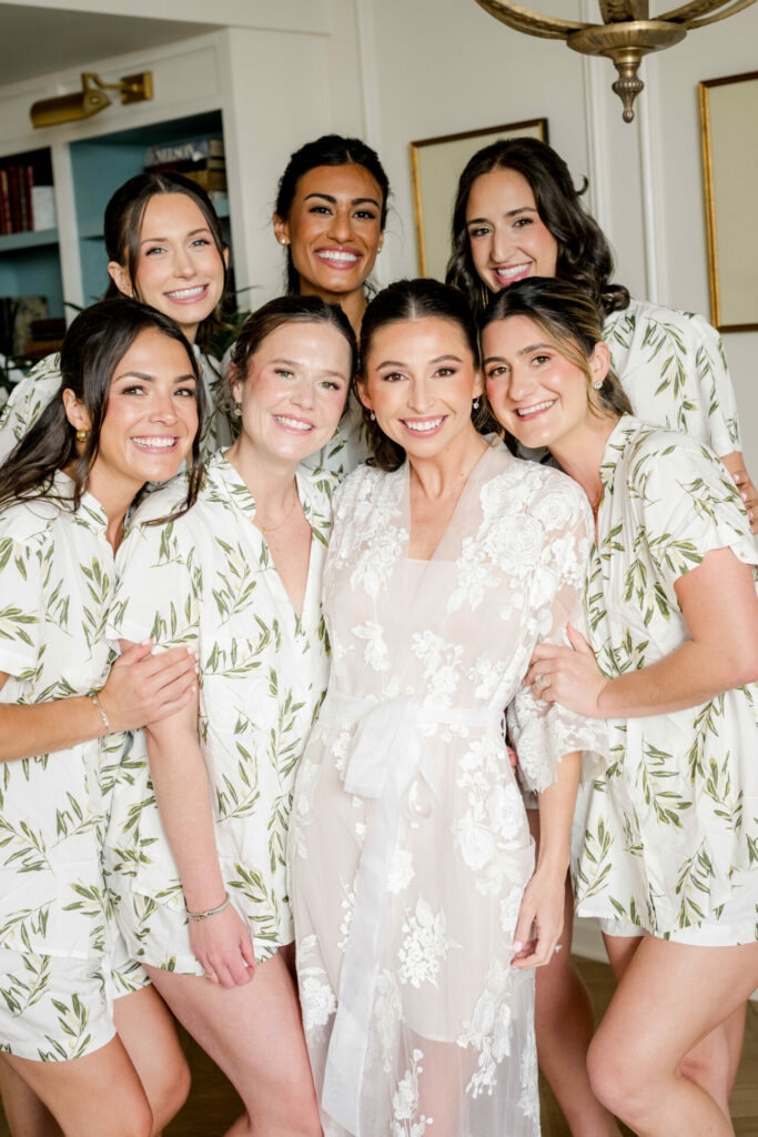 Bride Katya Ruiz with six friends in floral pajamas.