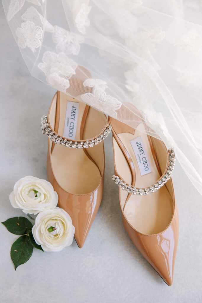 Beige jeweled Jimmy Choos with roses and veil.