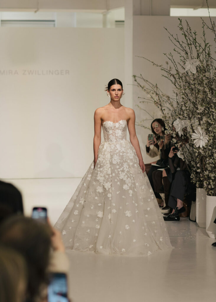 Model wearing the Alma A-line wedding dress by Mira Zwillinger on the runway