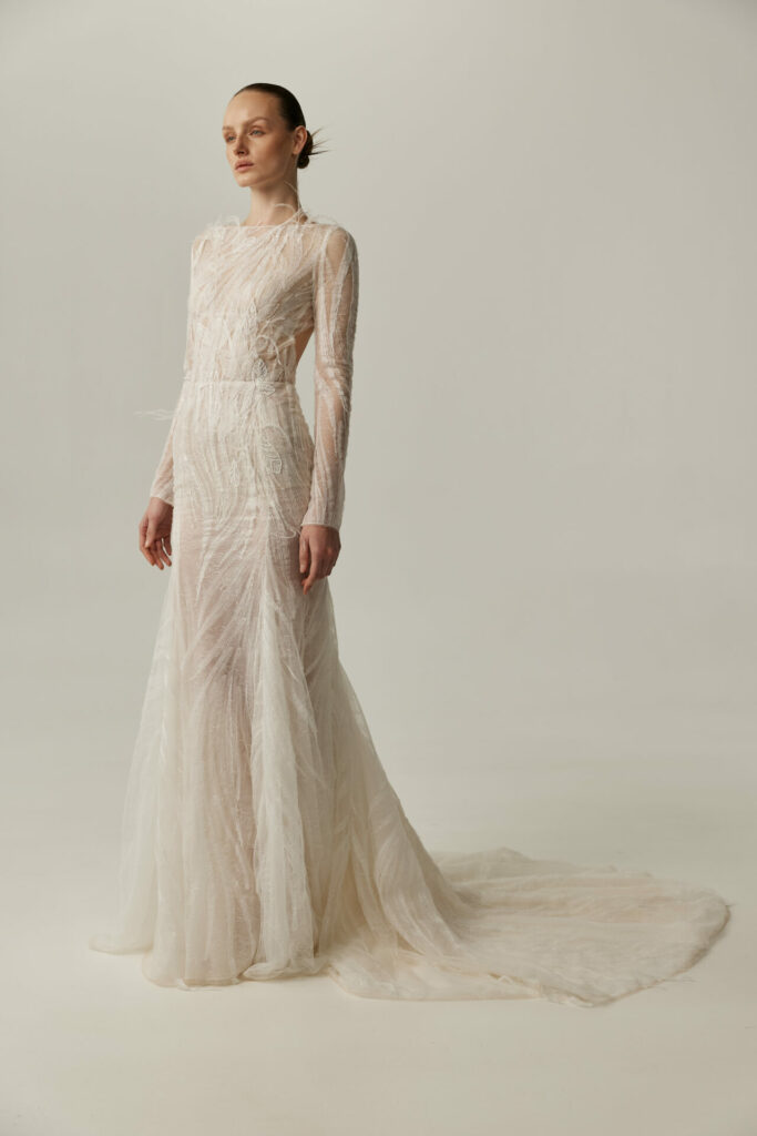 Bride in the sheer long-sleeve Anouka wedding dress by Mira Zwillinger