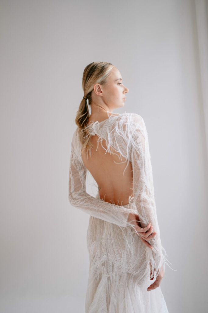 Bride in the sheer Anouka wedding dress by Mira Zwillinger
