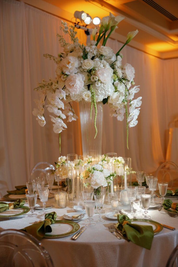 Luxury bridal table with orchids and candles.